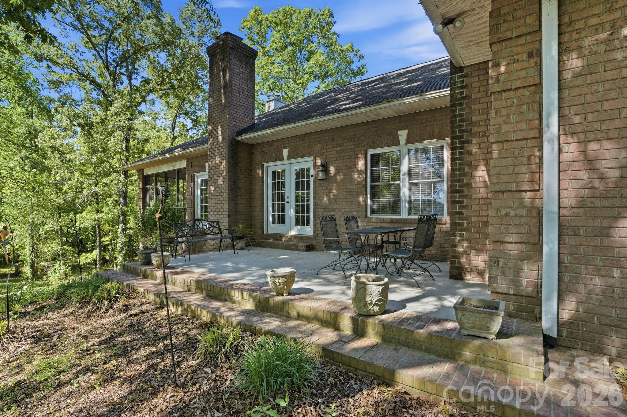 2275 River Road Richfield, NC 28137 - Photo 40 of 44 a front view of a house with outdoor seating