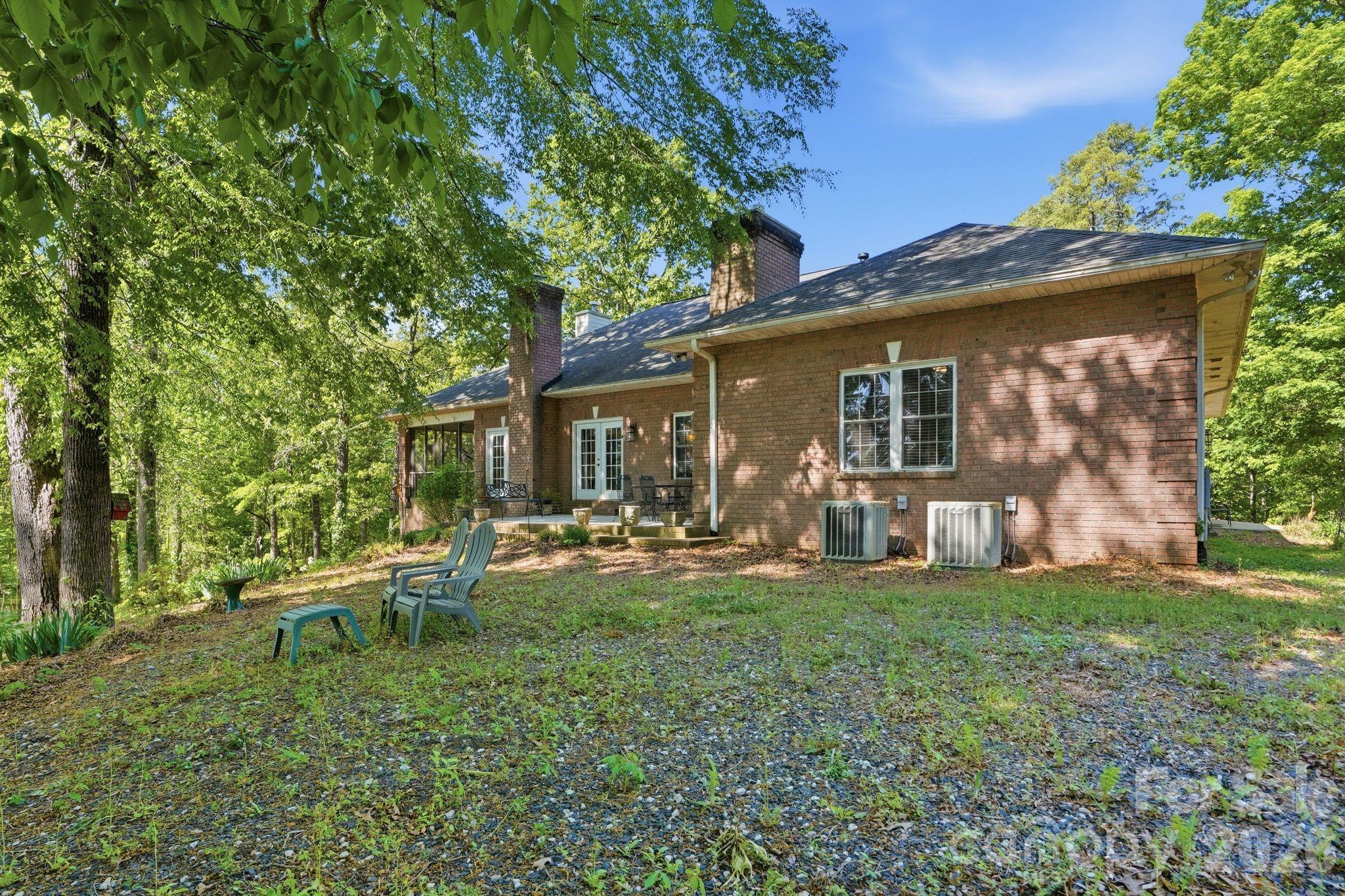 2275 River Road Richfield, NC 28137 - Photo 41 of 44 a view of a house with backyard porch and sitting area