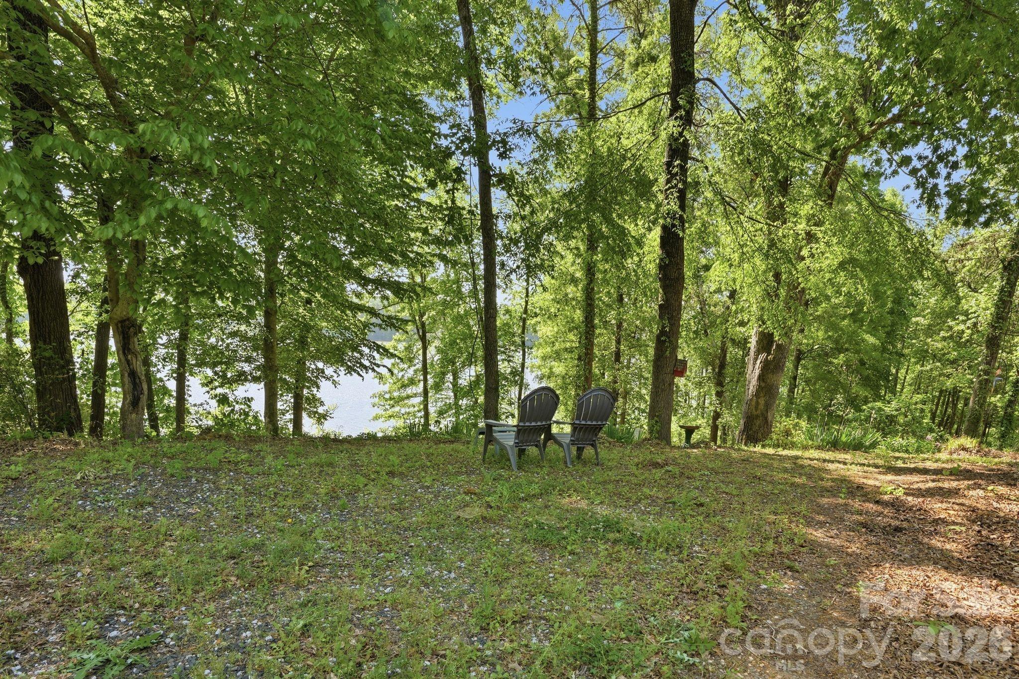 2275 River Road Richfield, NC 28137 - Photo 8 of 44 a backyard of a house with lots of green space
