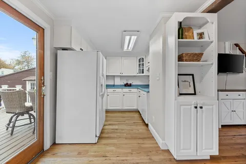 a kitchen with stainless steel appliances a refrigerator and a stove