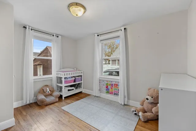 a bedroom with furniture and a window