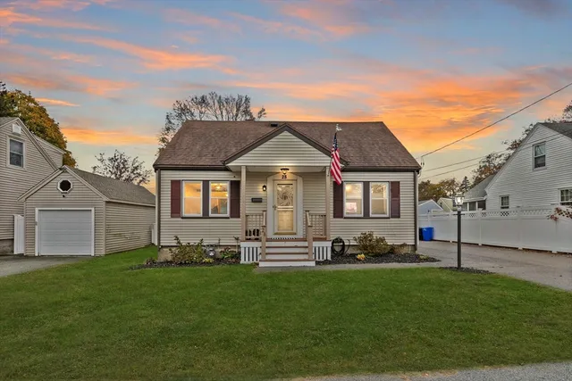 a front view of a house with a garden