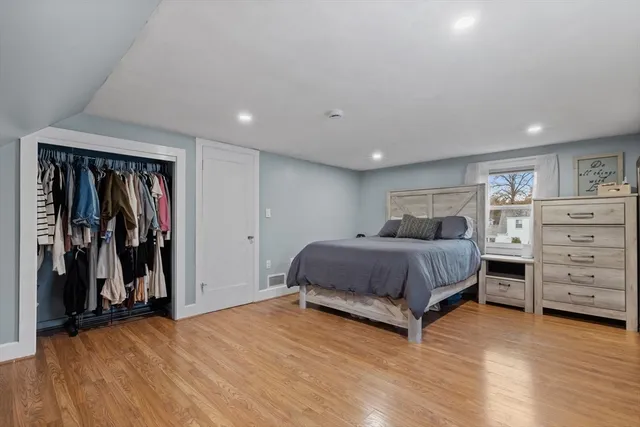 a bedroom with a bed and a closet
