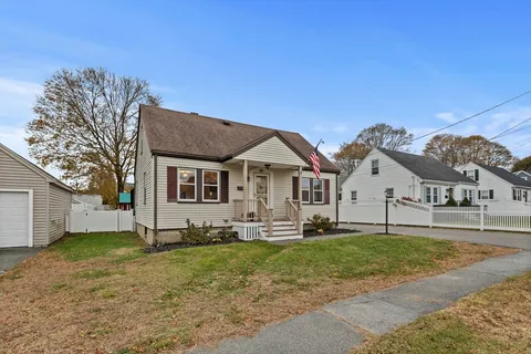 a view of house with yard