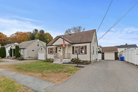 a view of house with yard and entertaining space