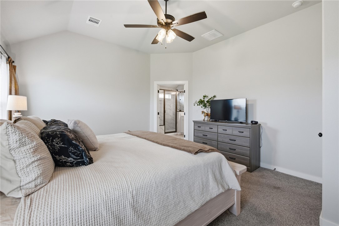 3112 Margaret Rudder Parkway Bryan, TX 77808 - Photo 13 of 24 a bedroom with a bed and a tv