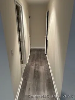 an entryway with wooden floor