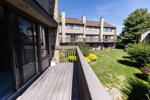 a view of balcony with a swimming pool