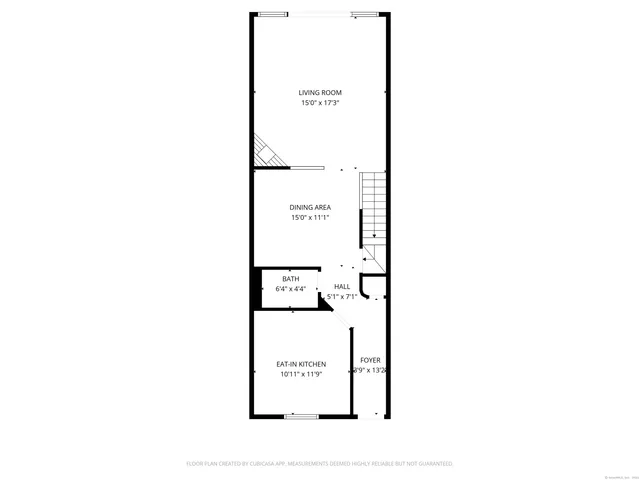 a picture of a bench in front of a wall