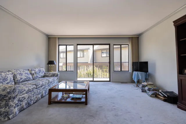 a spacious bedroom with a bed and a couch