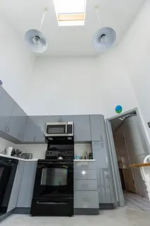 a kitchen with a stove and a microwave