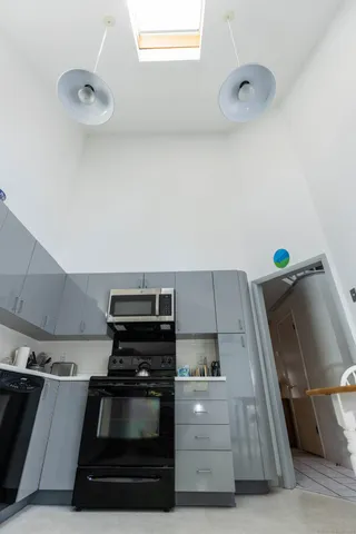 a kitchen with a stove and a microwave