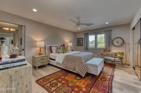 a view of house with garden space and sitting area