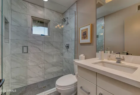 a view of an chairs and table in the patio