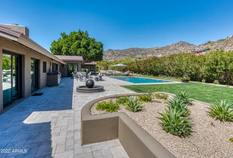 a view of a patio with a table and chairs