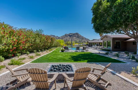 a view of a patio with a dining table and chairs