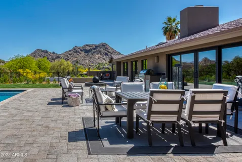 a view of a swimming pool with a patio