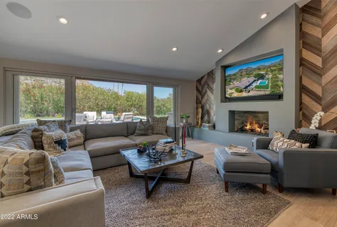 a living room with furniture and a large window