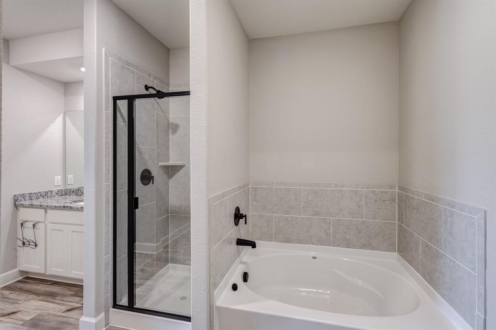 1816 Jeanine Drive Anna, TX 75409 - Photo 16 of 23 a white bath tub sitting next to a shower