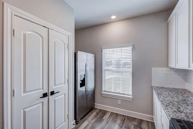 a view of livingroom with hardwood floor and hallway