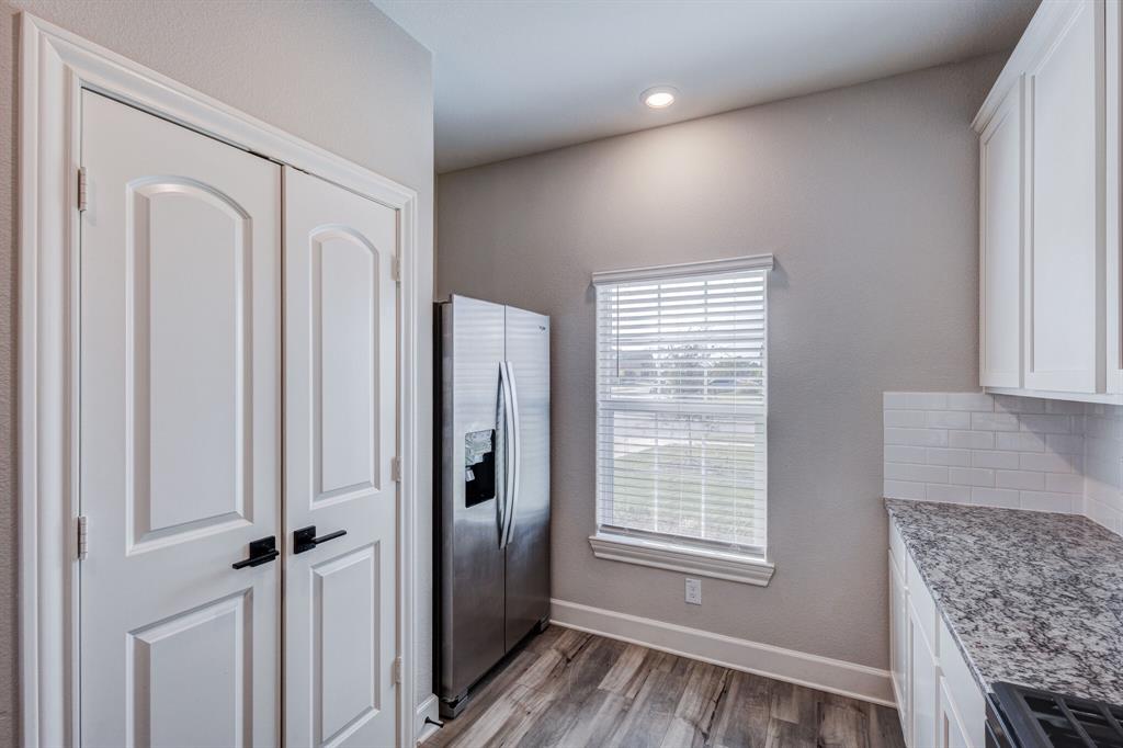 1816 Jeanine Drive Anna, TX 75409 - Photo 6 of 23 a view of livingroom with hardwood floor and hallway