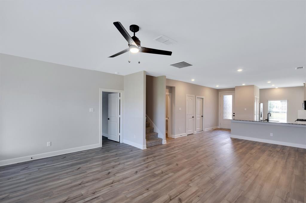 1816 Jeanine Drive Anna, TX 75409 - Photo 9 of 23 a view of a room with wooden floor and windows