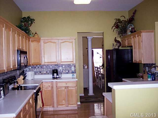 3102 Spring Fancy Lane Indian Trail, NC 28079 - Photo 2 of 11 a bathroom with a sink a mirror and a shower