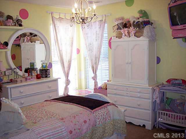 3102 Spring Fancy Lane Indian Trail, NC 28079 - Photo 11 of 11 a bedroom with a bed dresser and a window