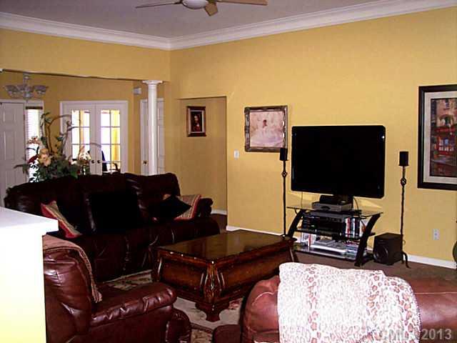 3102 Spring Fancy Lane Indian Trail, NC 28079 - Photo 6 of 11 a living room with furniture and a flat screen tv