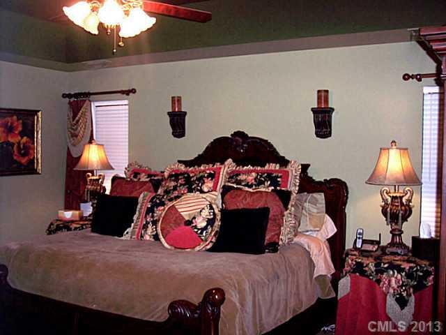 3102 Spring Fancy Lane Indian Trail, NC 28079 - Photo 9 of 11 a bed room with a bed and a lamp