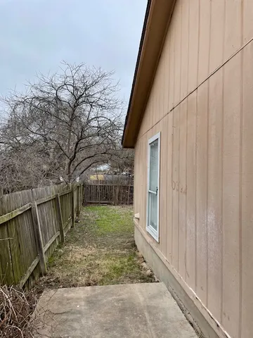 a view of a backyard with pathway