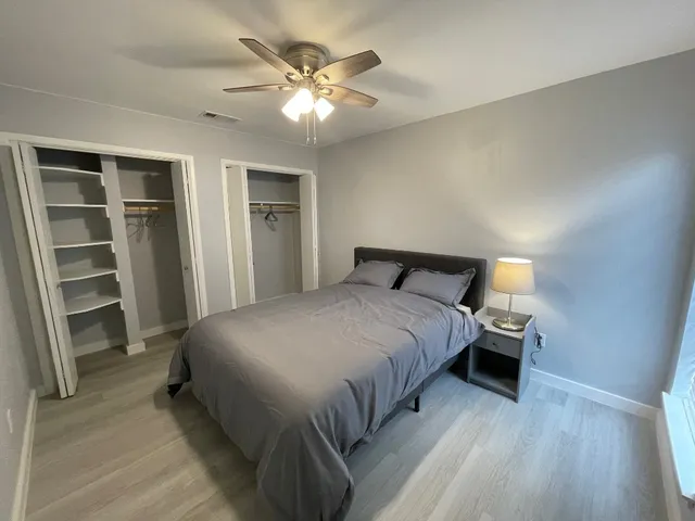 a kitchen with kitchen island cabinets and chairs in it