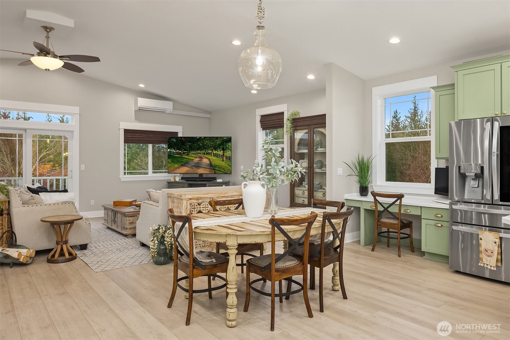6937 Lake Alice Road Southeast Fall City, WA 98024 - Photo 13 of 39 a view of a dining room with furniture window and wooden floor