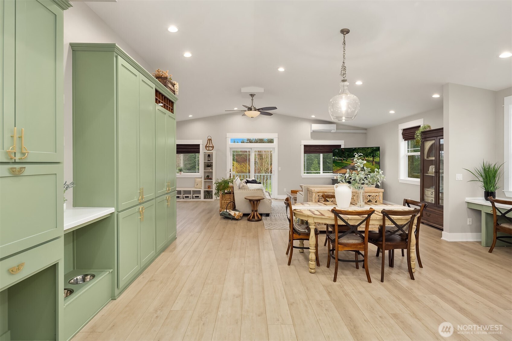6937 Lake Alice Road Southeast Fall City, WA 98024 - Photo 15 of 39 a view of a dining room with furniture window and wooden floor