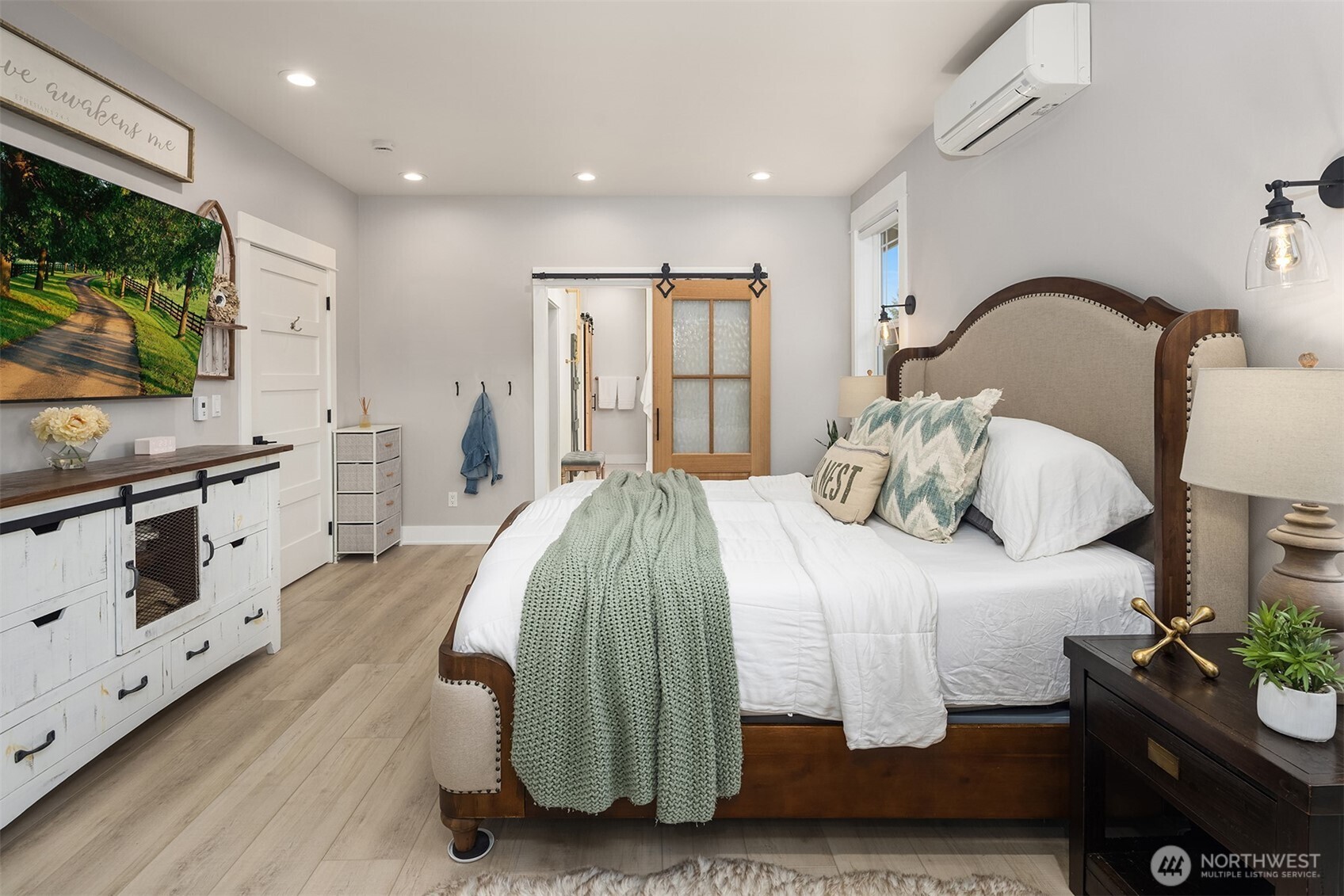 6937 Lake Alice Road Southeast Fall City, WA 98024 - Photo 19 of 39 a bedroom with a bed and a flat screen tv