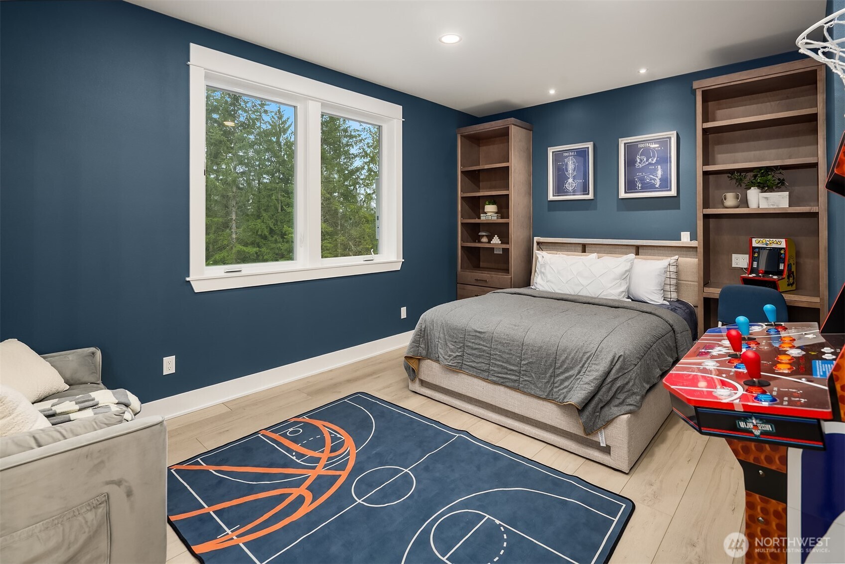 6937 Lake Alice Road Southeast Fall City, WA 98024 - Photo 22 of 39 a bedroom with a bed and a chandelier