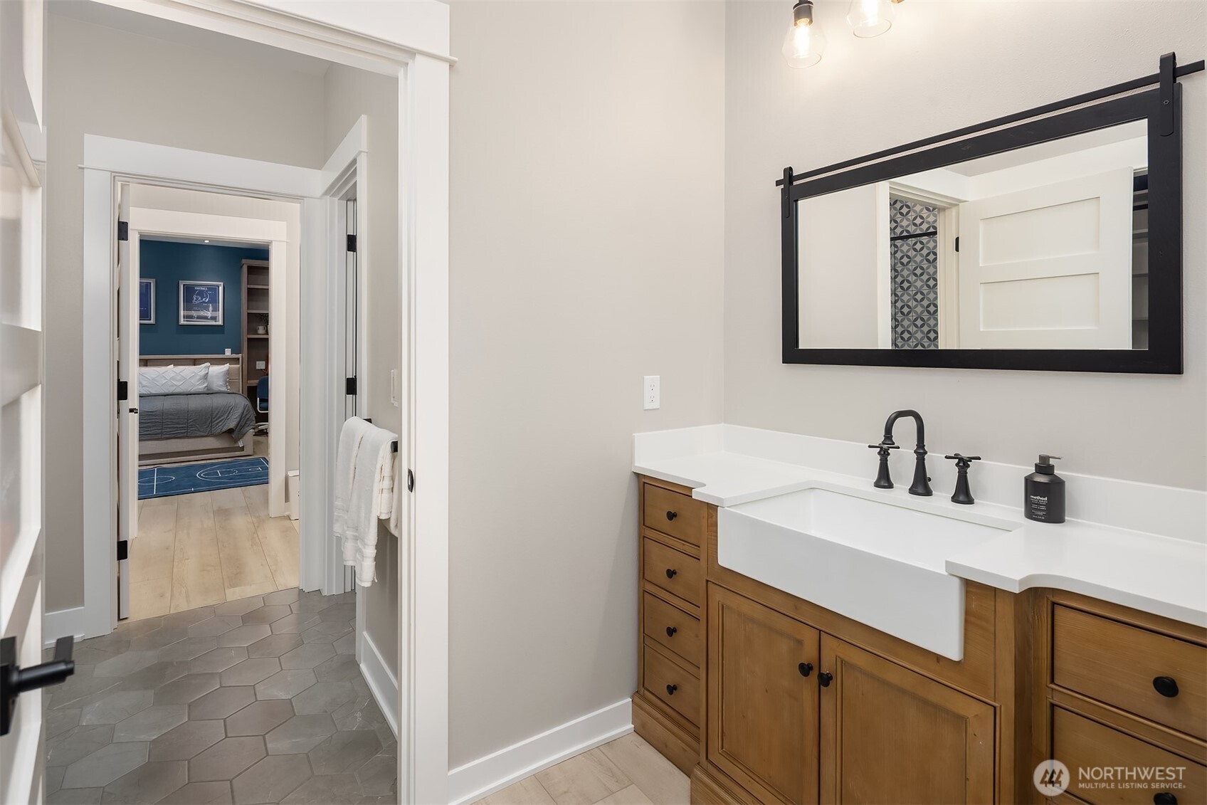 6937 Lake Alice Road Southeast Fall City, WA 98024 - Photo 25 of 39 a bathroom with a sink a mirror and a shower