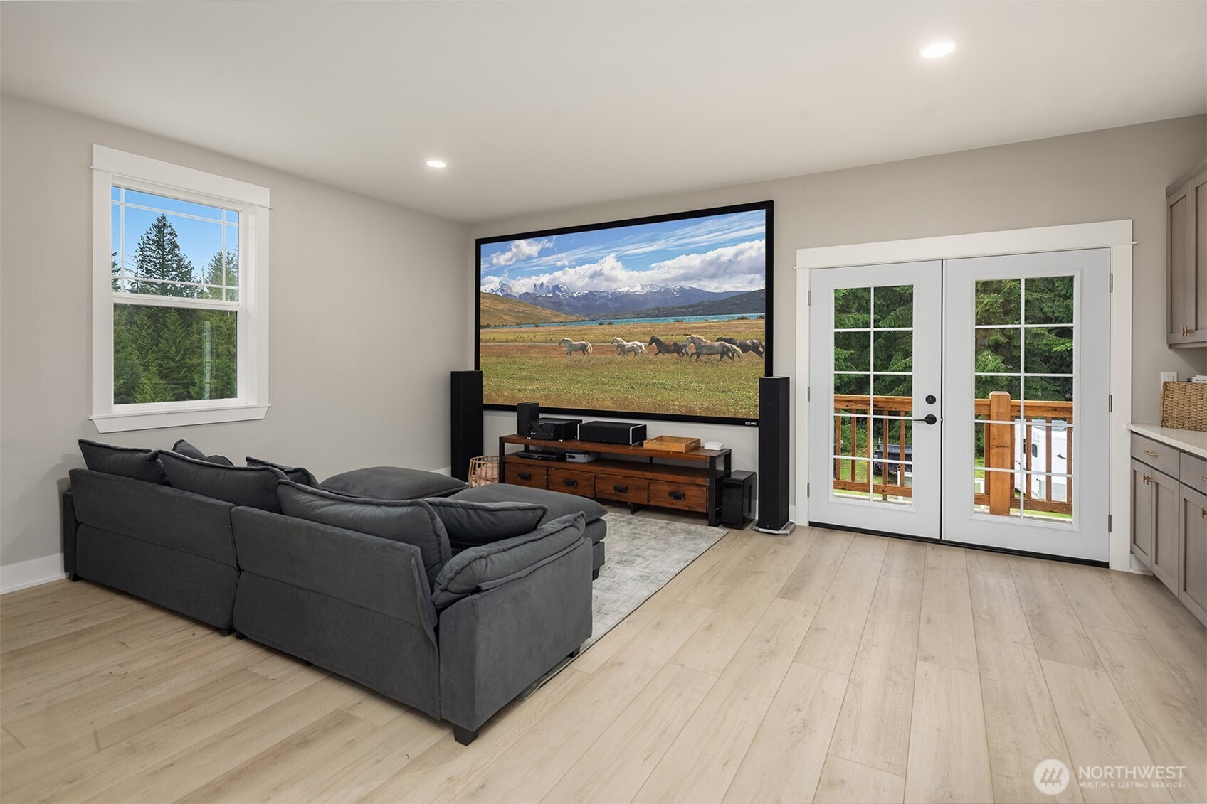 6937 Lake Alice Road Southeast Fall City, WA 98024 - Photo 27 of 39 a living room with furniture and a flat screen tv
