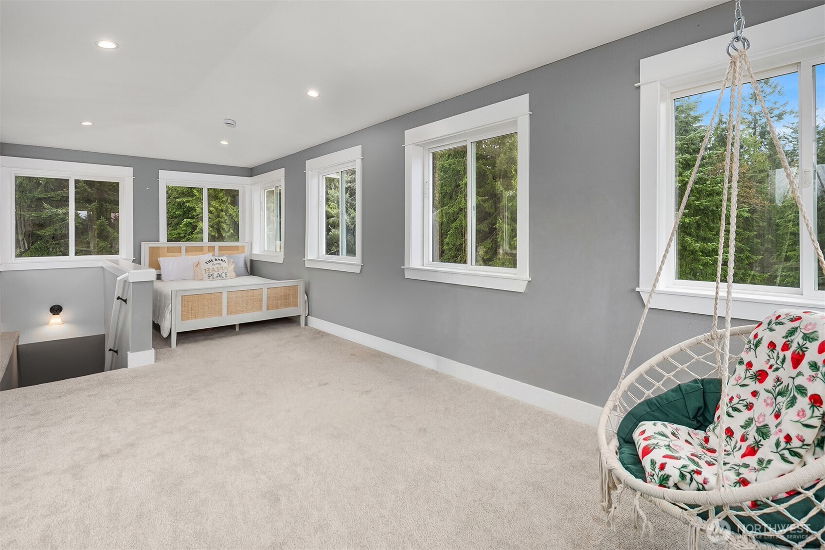 6937 Lake Alice Road Southeast Fall City, WA 98024 - Photo 30 of 39 a bed room with a bed and a chair