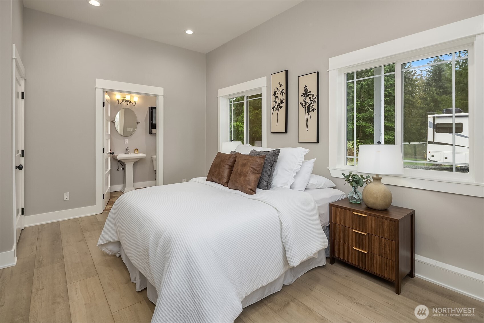 6937 Lake Alice Road Southeast Fall City, WA 98024 - Photo 31 of 39 a bedroom with a bed and large windows