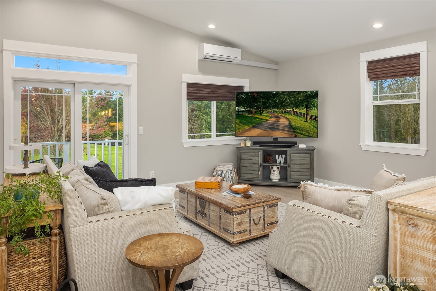 6937 Lake Alice Road Southeast Fall City, WA 98024 - Photo 6 of 39 a living room with furniture fireplace and window