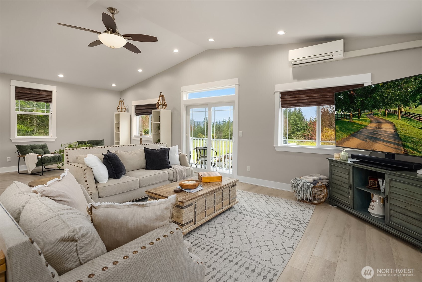 6937 Lake Alice Road Southeast Fall City, WA 98024 - Photo 7 of 39 a living room with furniture fireplace and a window