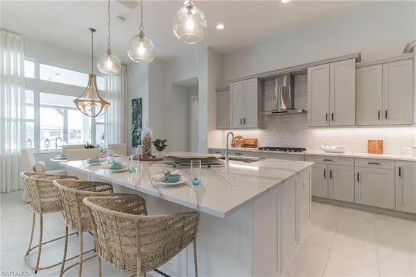 a kitchen with a sink stove and cabinets
