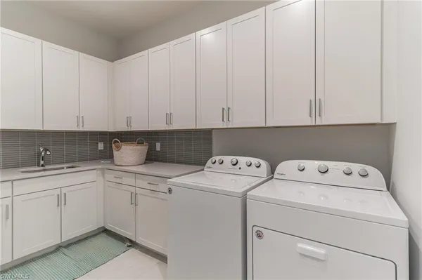 a view of storage and utility room with washer and dryer
