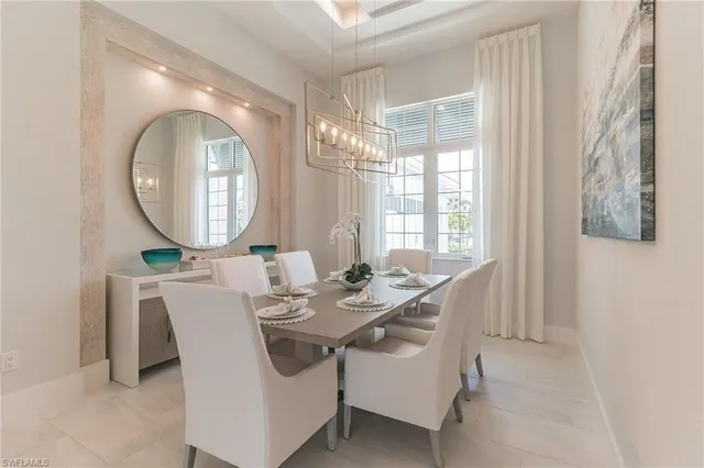 a dining room with furniture a mirror and a bathtub