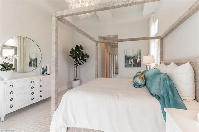 a bedroom with a bed and a dresser