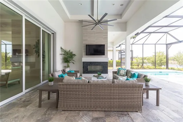 a living room with fireplace furniture and a flat screen tv