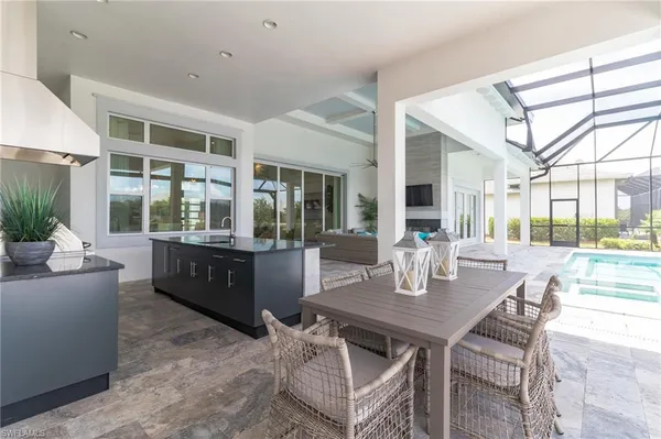a dining room with furniture and wooden floor