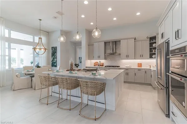 a kitchen with counter top space cabinets and stainless steel appliances