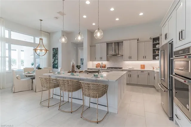 a kitchen with counter top space cabinets and stainless steel appliances